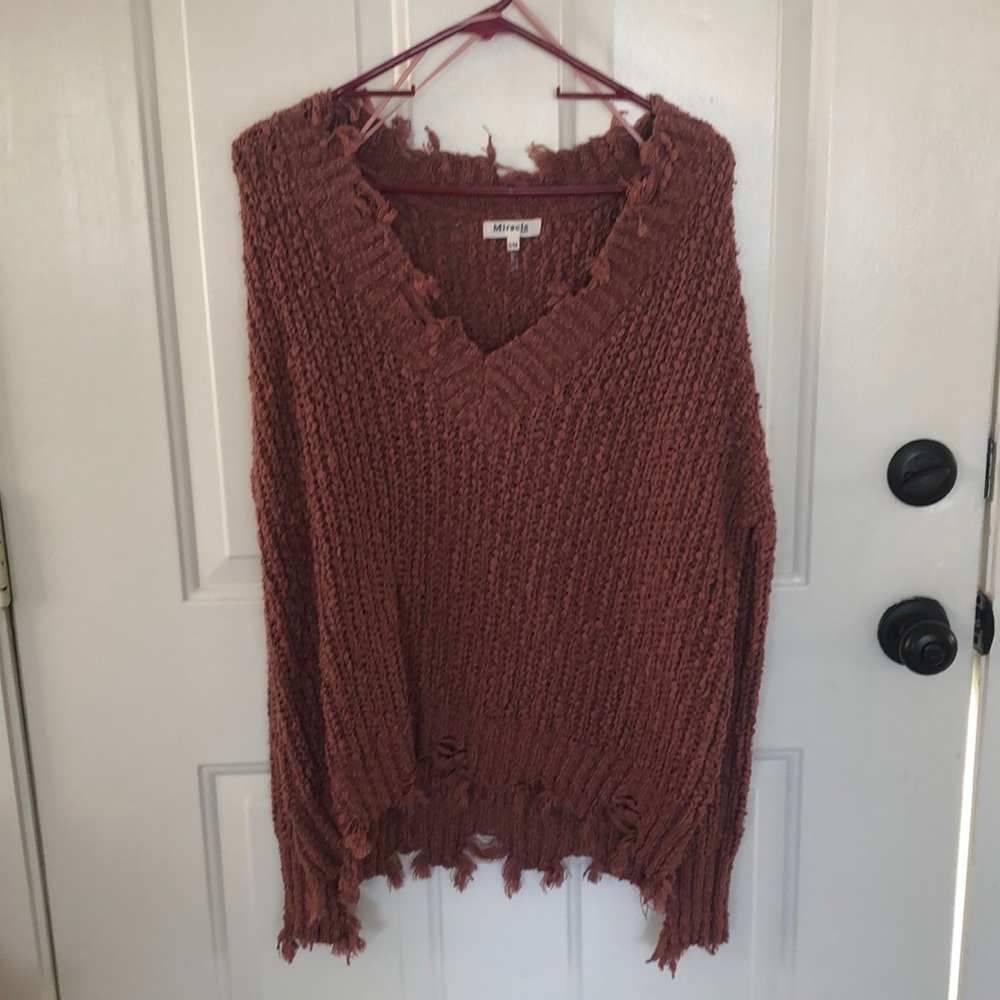 Tattered knit sweater